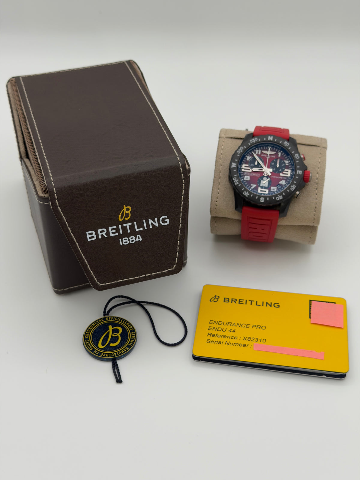 UNWORN 2026 Breitling Endurance Pro IRONMAN® Special Edition Red Dial w/ Red Rubber Strap X82310 -Complete Set - WARRANTY