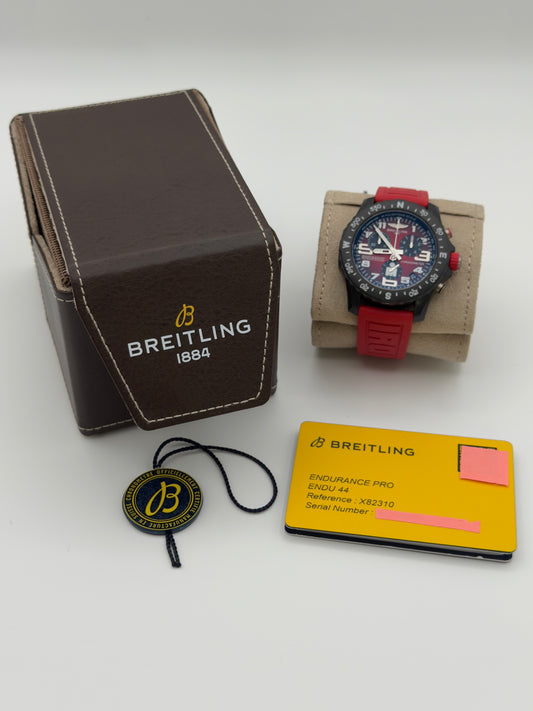 UNWORN 2026 Breitling Endurance Pro IRONMAN® Special Edition Red Dial w/ Red Rubber Strap X82310 -Complete Set - WARRANTY